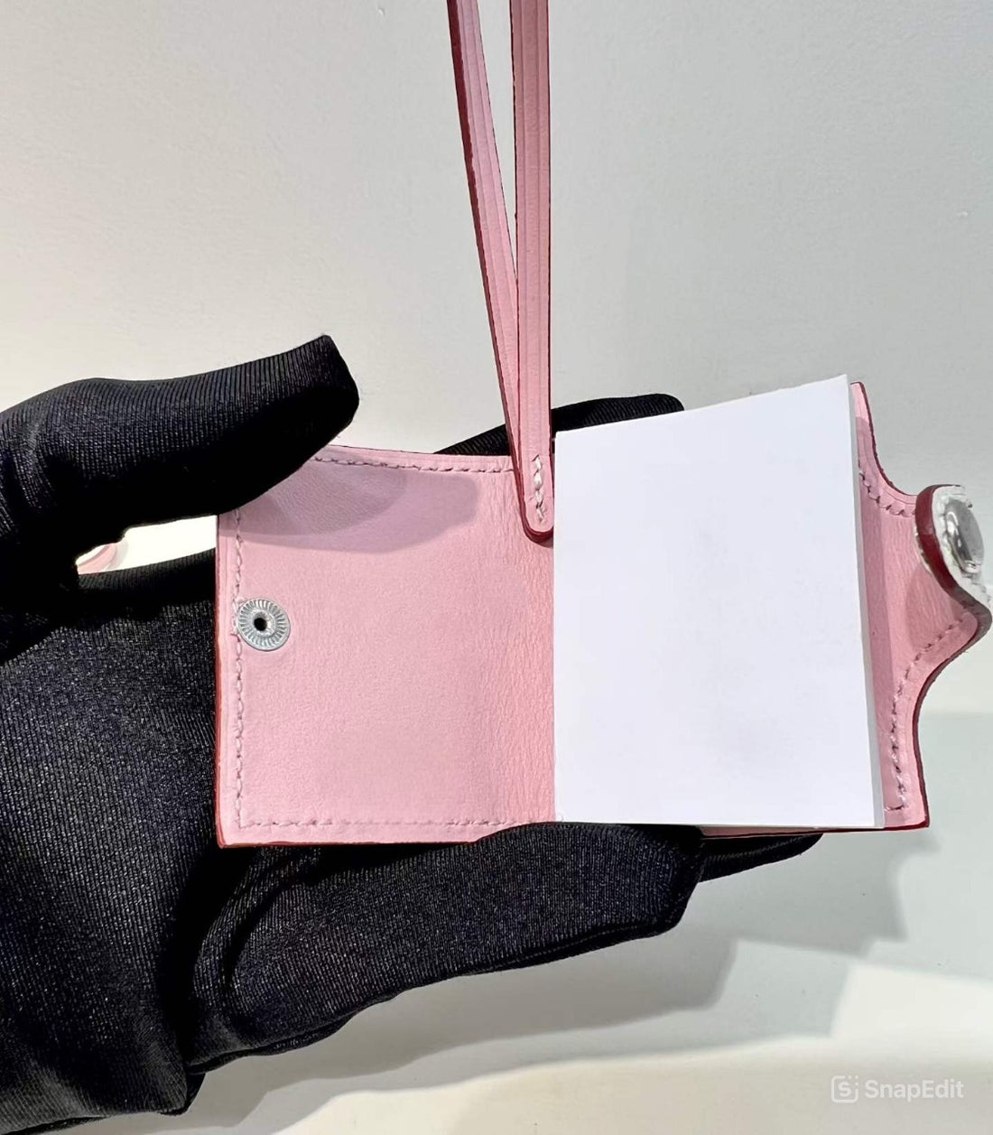 Inside view of blush pink hand-stitched leather mini notebook bag charm