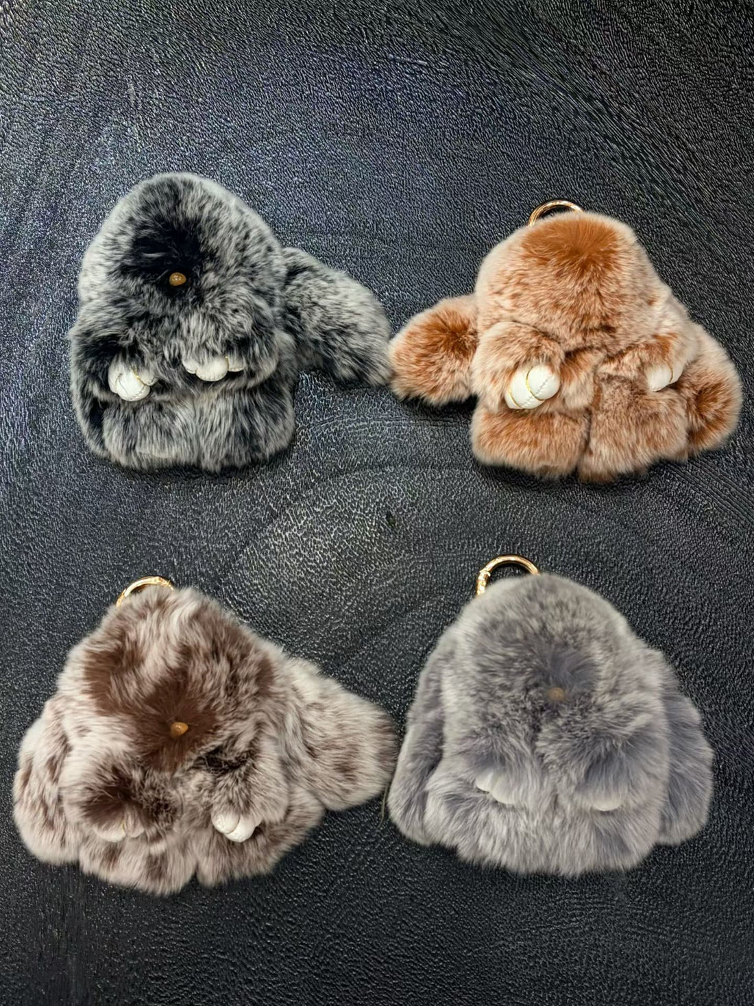 Neutral marbled fluffy bunny bag charms in gray caramel and brown