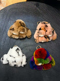 Spotted fluffy bunny bag charms in tan blush white and rainbow colors