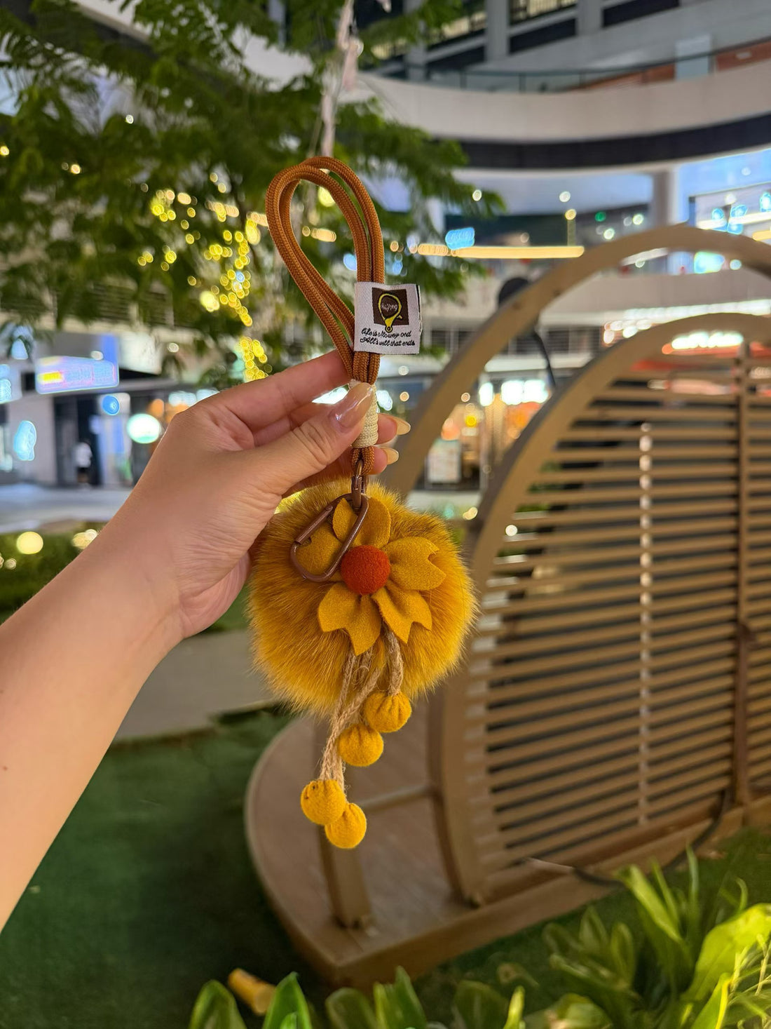 Golden yellow fluffy flower bag charm with rope loop and pom-pom tassels