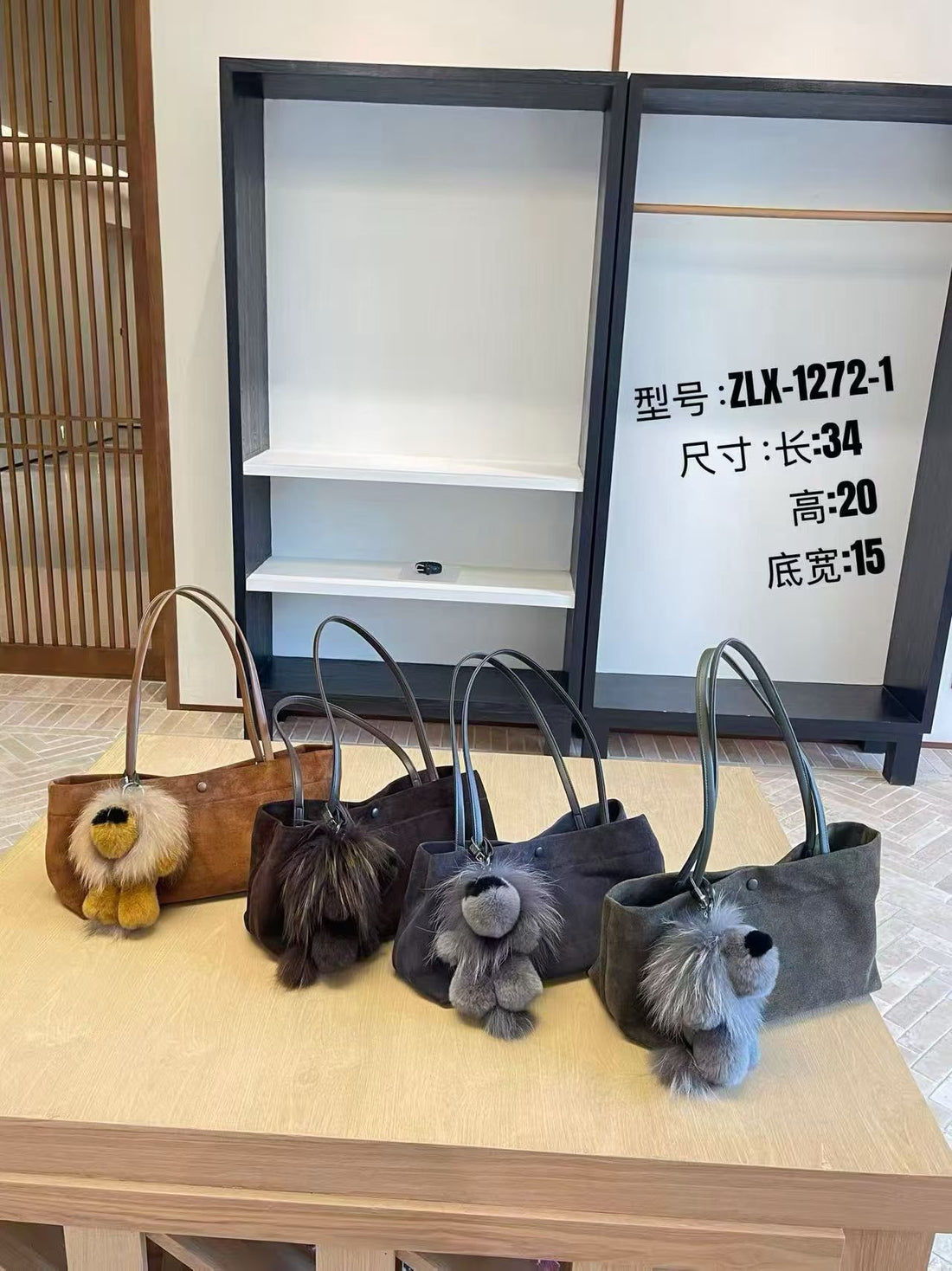 Four fluffy lion bag charm colors displayed on tote bags