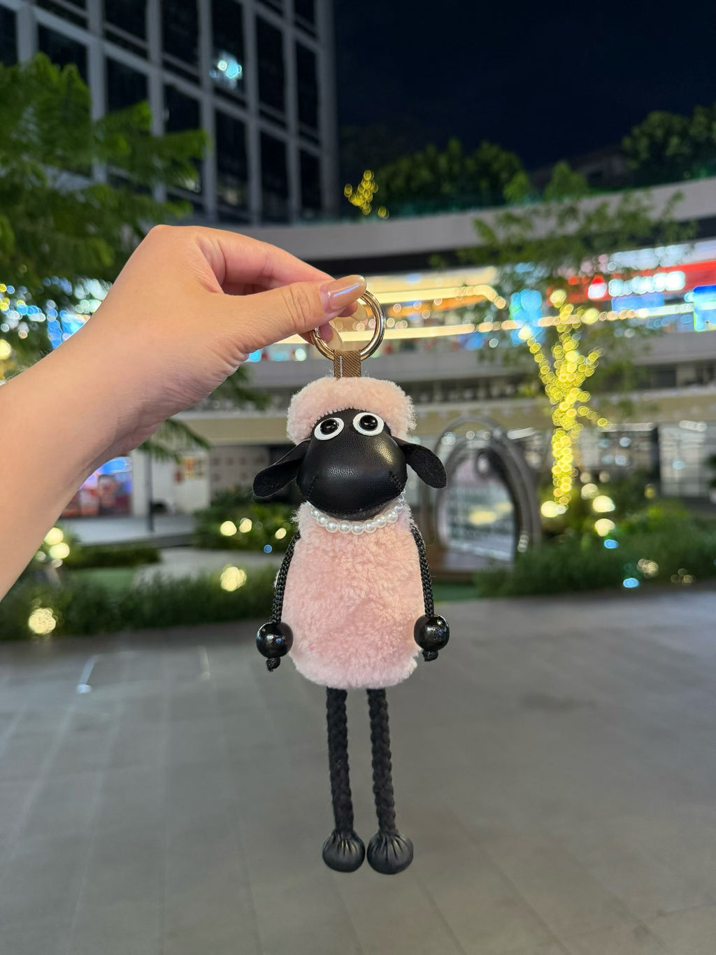 Blush pink fluffy Shaun sheep bag charm with pearl collar