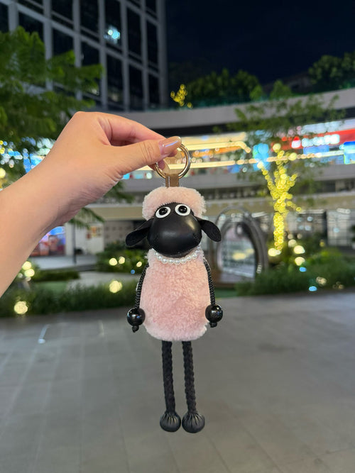Blush pink fluffy Shaun sheep bag charm with pearl collar